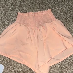stretchy waistband shorts from aerie/offline in a peach color